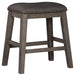 Caitbrook - Gray - Upholstered Stool Capital Discount Furniture Home Furniture, Furniture Store