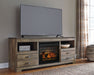Trinell - Brown - 63" TV Stand With Glass/Stone Fireplace Insert Capital Discount Furniture